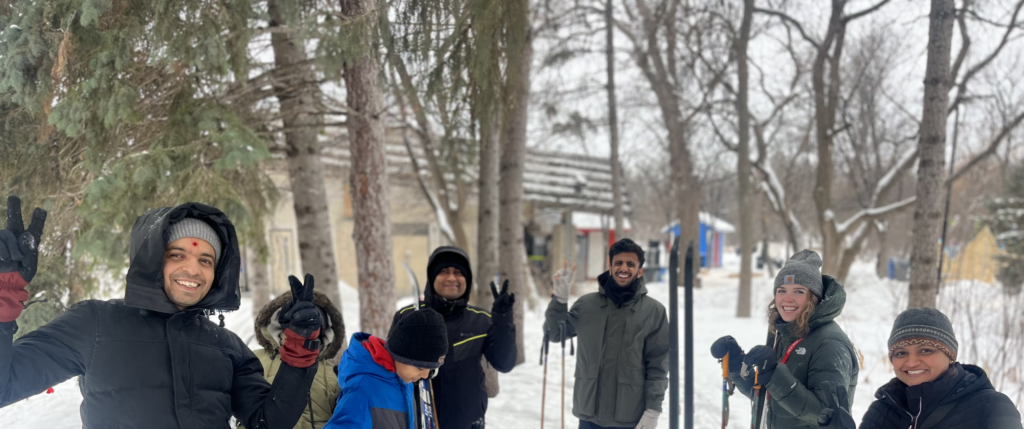 A group of smiling people in the snow
